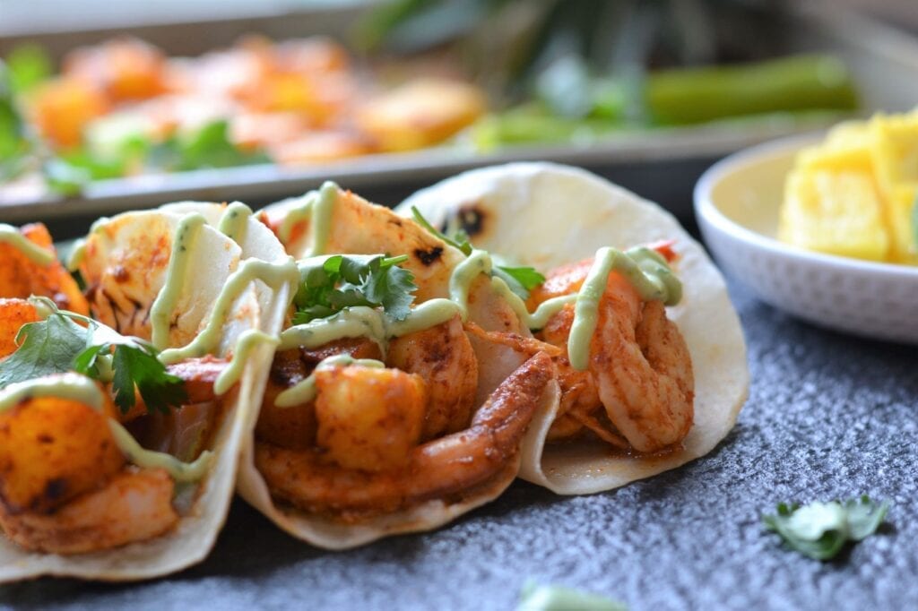 Sheet Pan Pineapple Shrimp Tacos with Creamy Avocado Cilantro Sauce