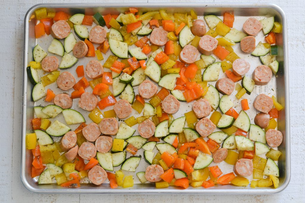 sausage, zucchini, and peppers on a sheet pan